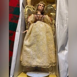 Seymour Mann 18" gold and peach porcelain angel doll - one fixed finger.  1995